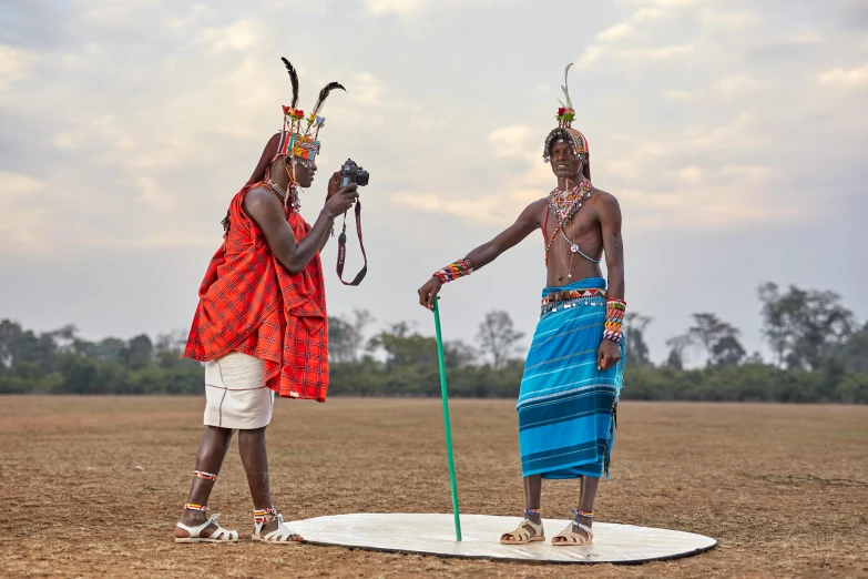 two native indian men in turbans on a surfboard