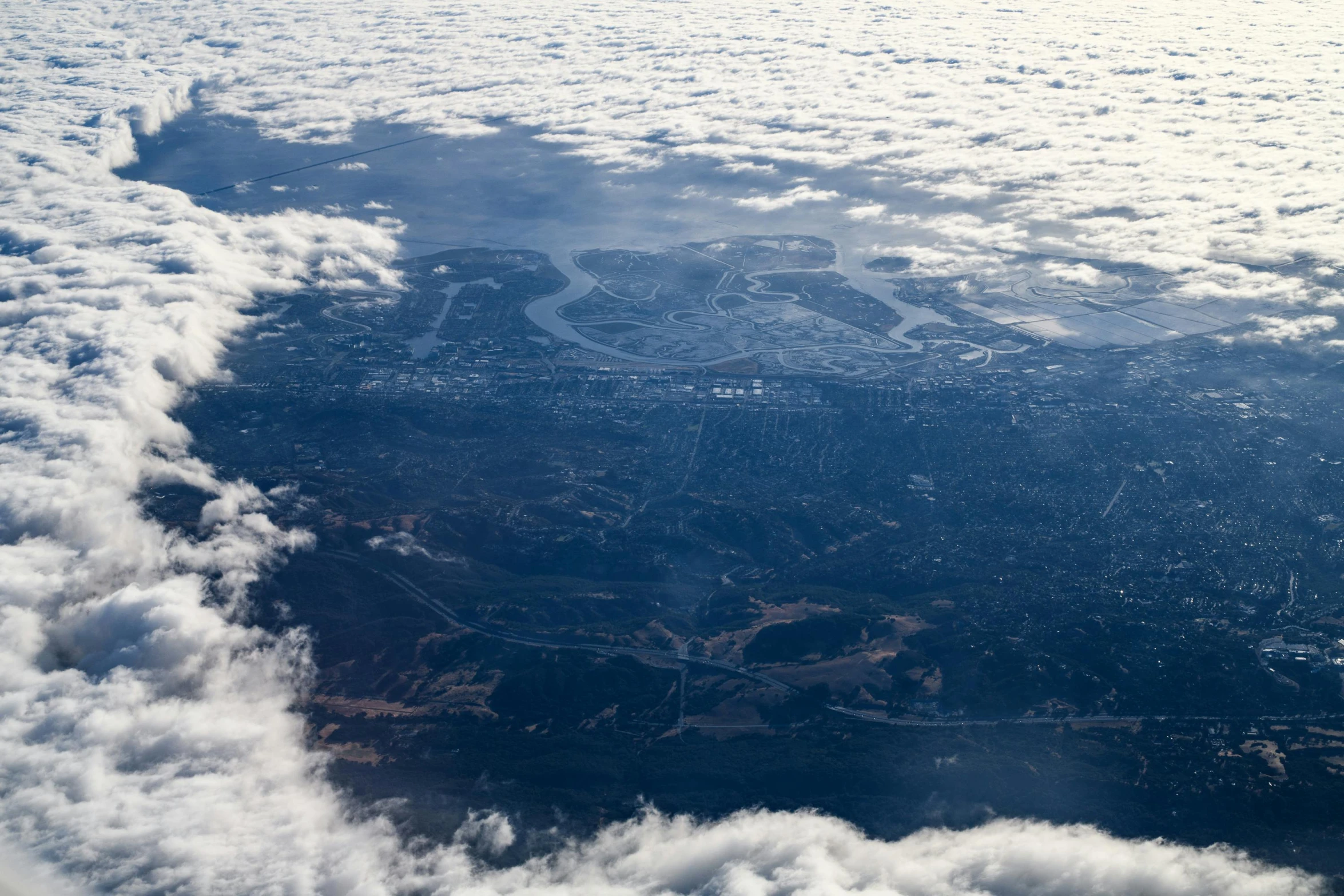 the view from an airplane is almost completely obscured by the clouds