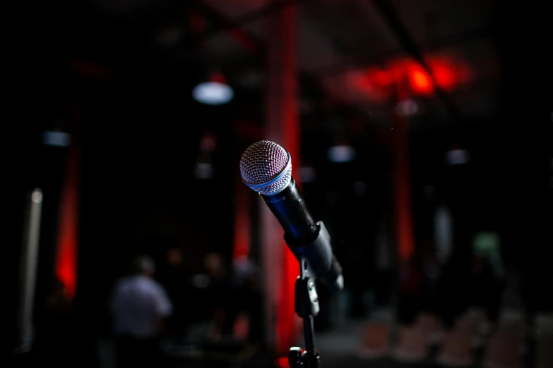 a microphone standing up in the dark