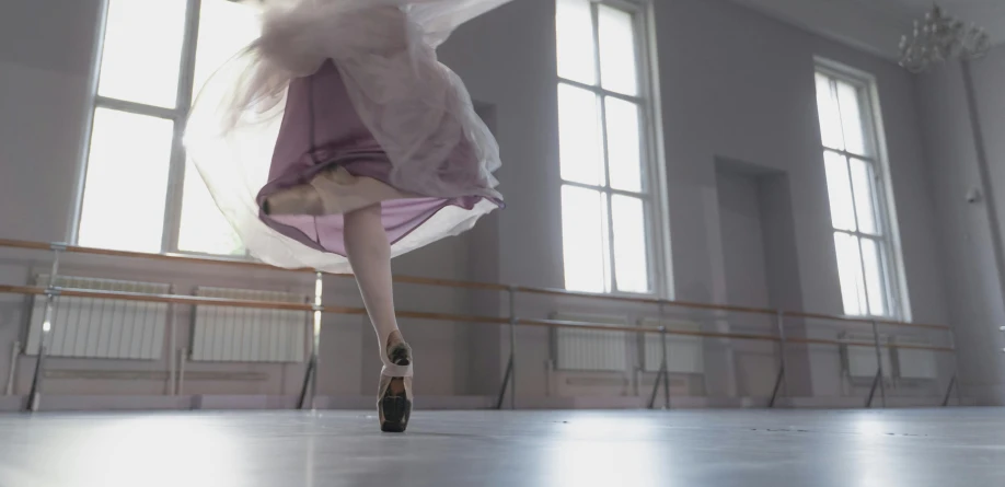 dancer in front of big windows with her 