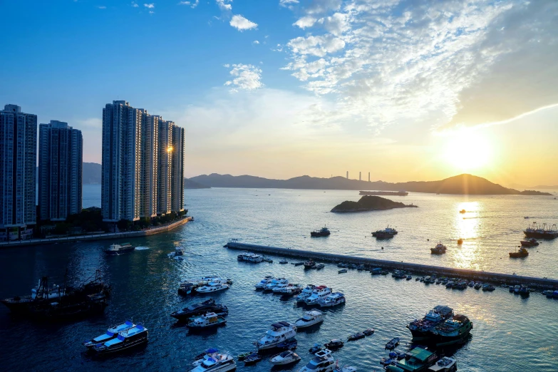 boats are in the ocean near large buildings