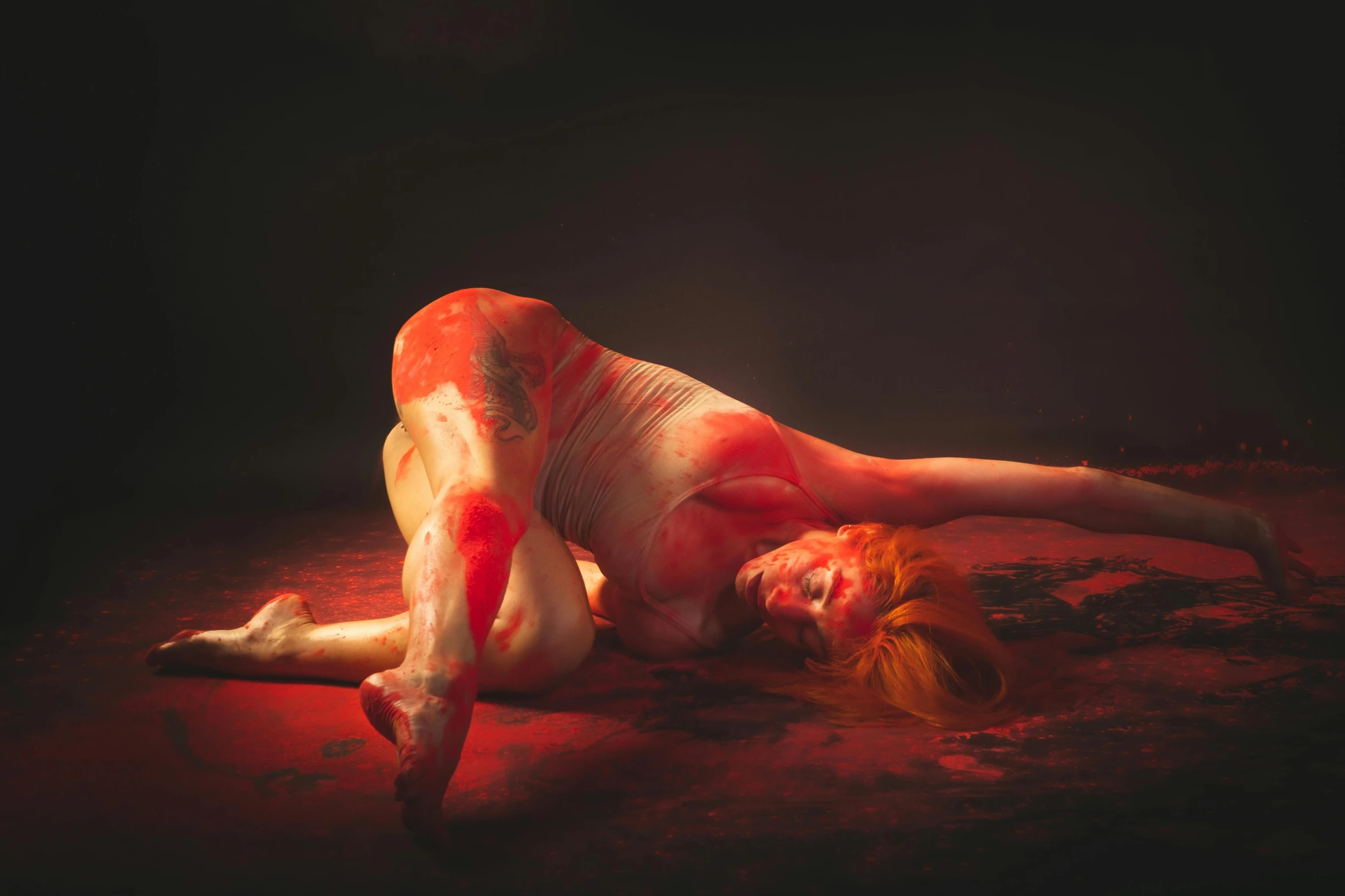 woman laying on the ground with y body and shoes
