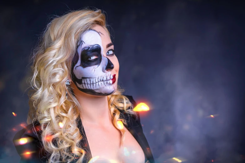 a woman with a skeleton makeup and hair is wearing a costume