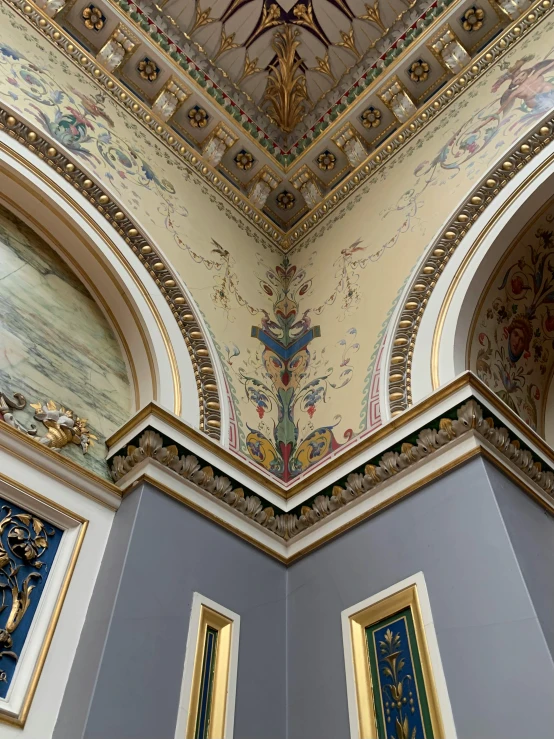 the ceiling and painting in the entrance hall