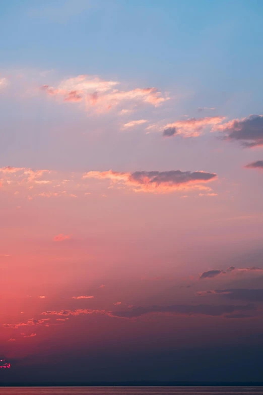 the view of a colorful sunset over a body of water