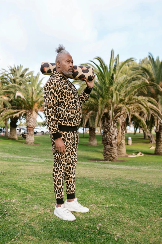 an image of a man wearing a leopard print suit