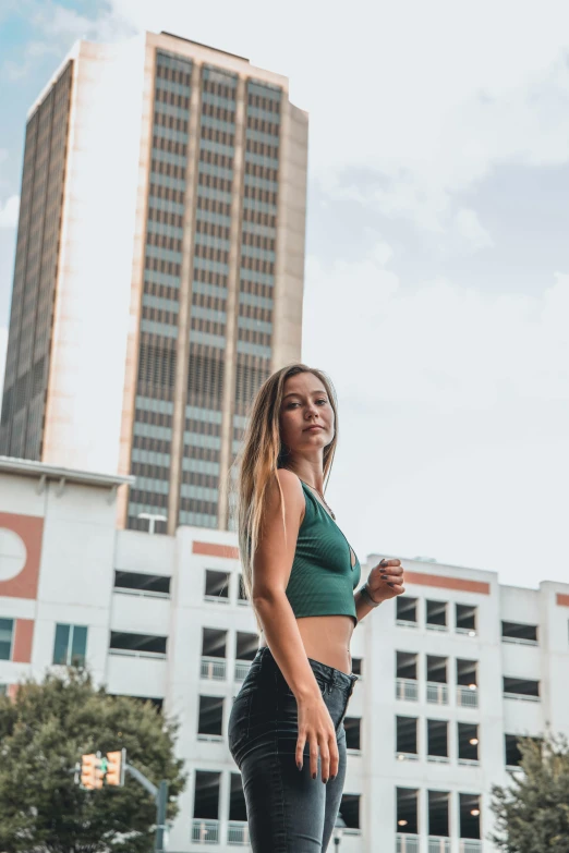 a woman running across a sidewalk in a city