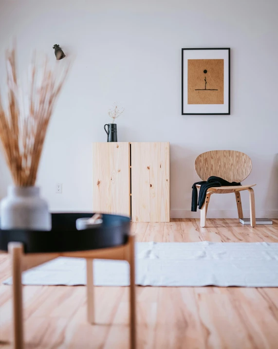 a chair and table in the corner of a room