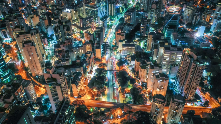 the city of buildings and a freeway at night