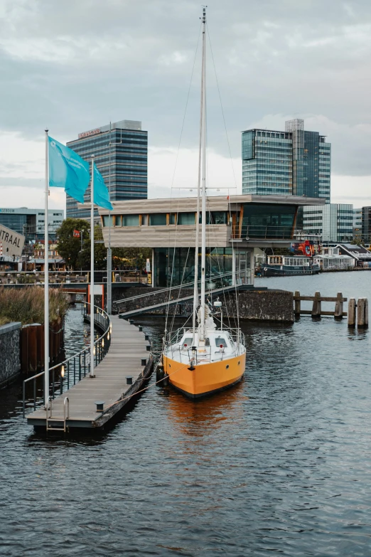 two boats are docked on the water in the city