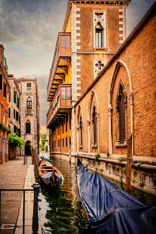 a narrow canal running between two buildings in the city