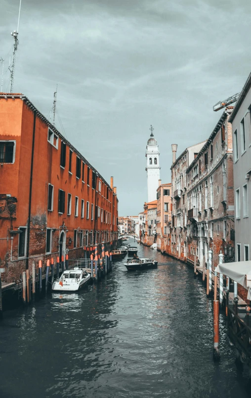 a street lined with tall buildings and lots of water