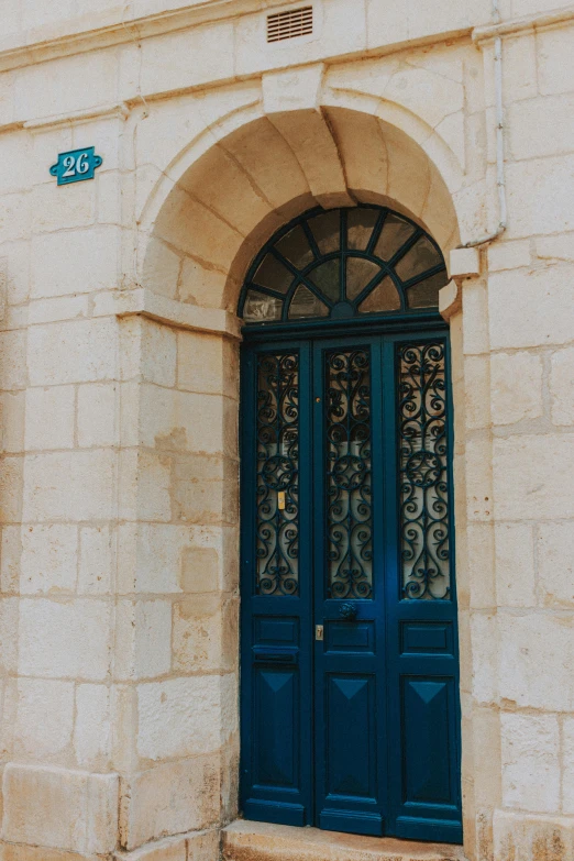 an archway with two doors in the center