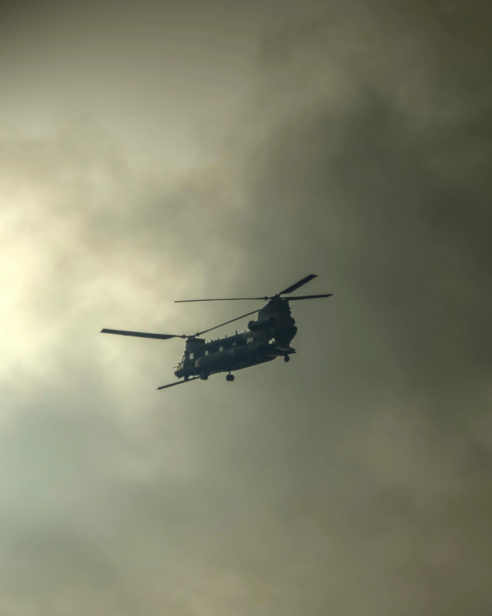 a helicopter is flying through the sky