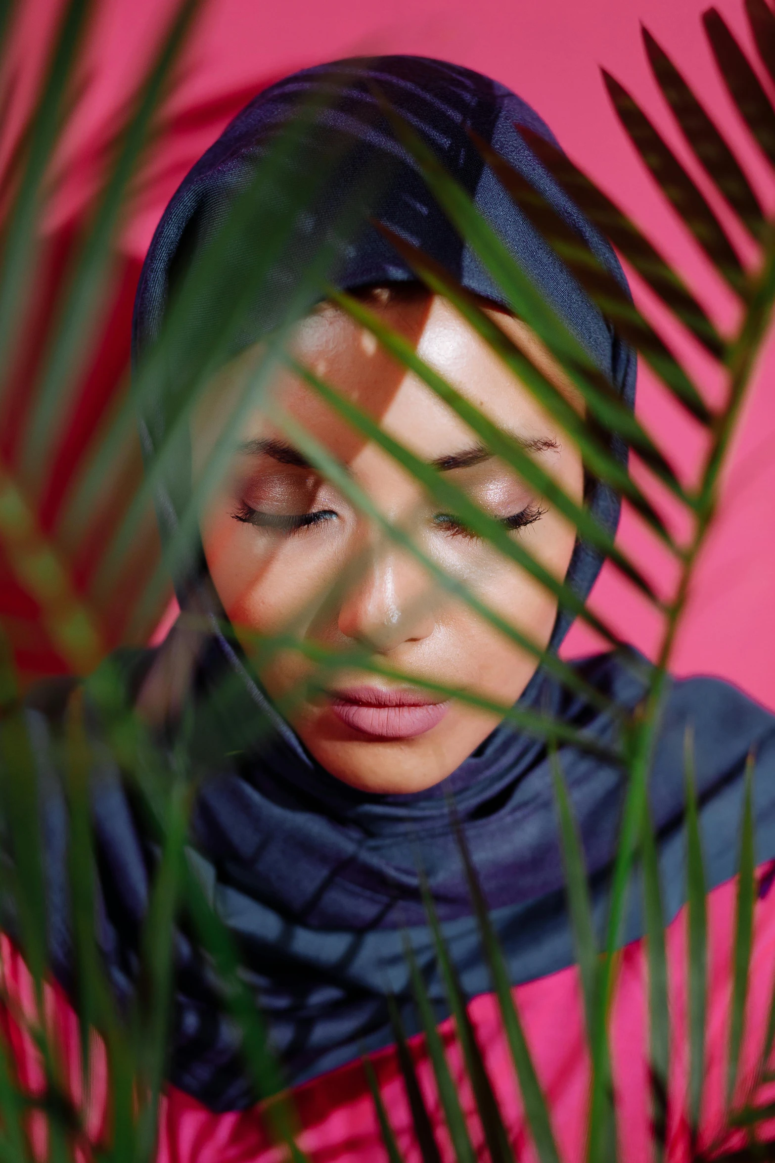 a woman in a hijab looking away from the camera