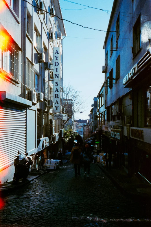 people walking in an urban area during the day