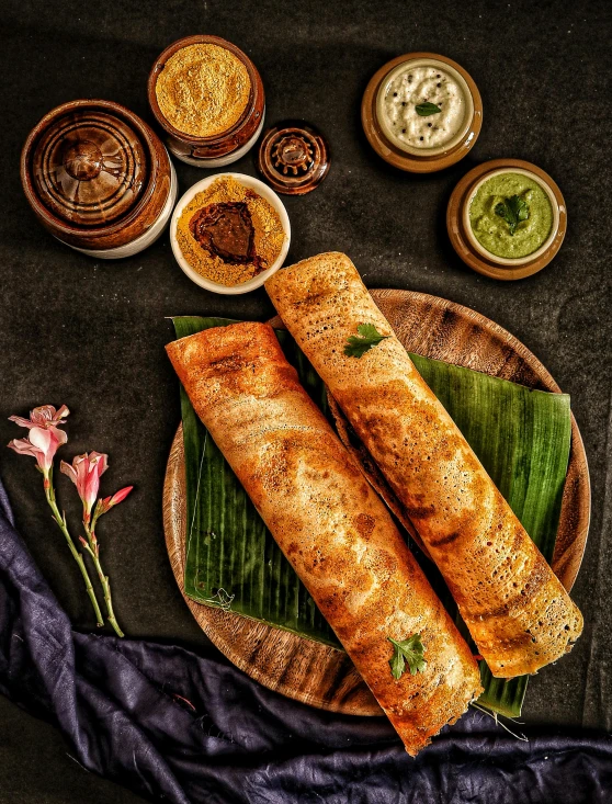 some indian food on a plate with some spices