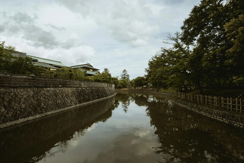 a waterway runs alongside the buildings near by