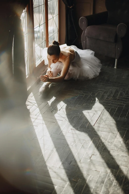 a woman is laying down in the sunlight