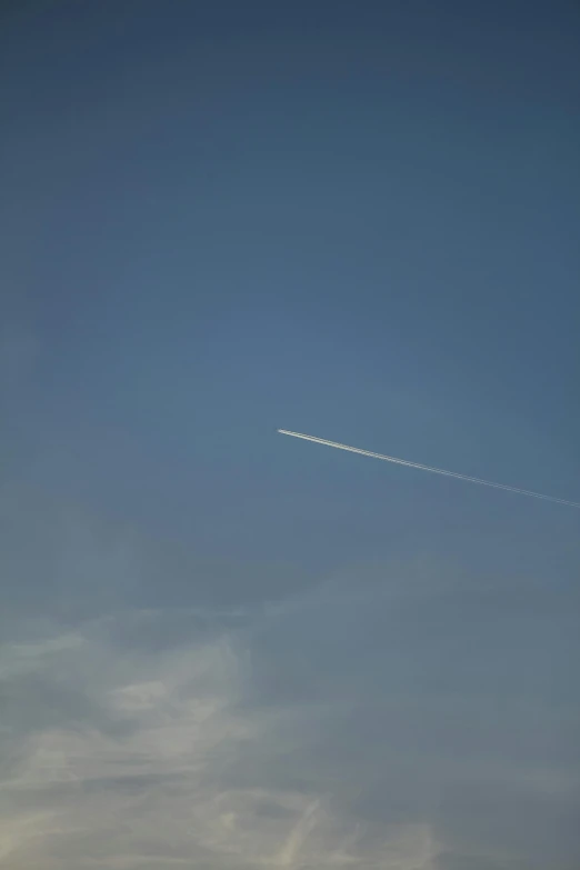 an airplane flying in the sky over water