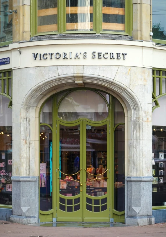 the front entrance to victoria's secret, featuring large round doorways and decorative wrought iron work