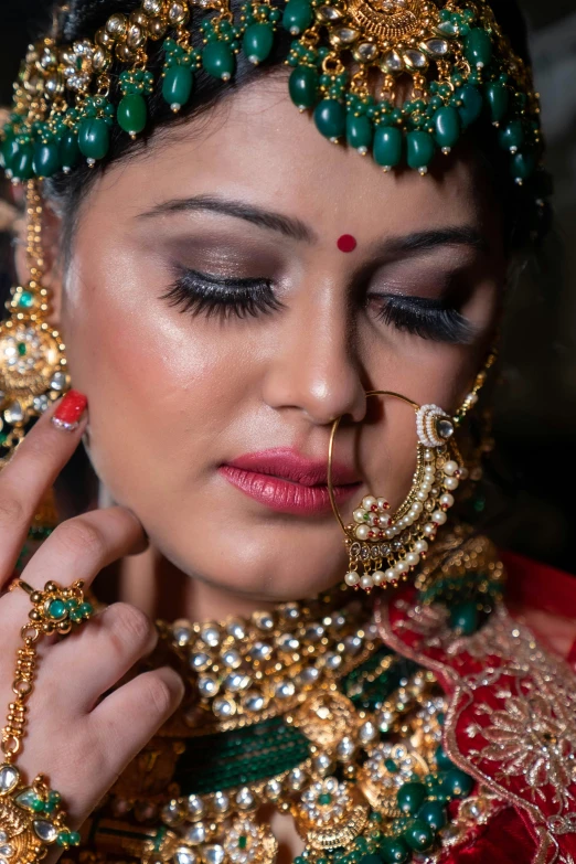 beautiful woman in traditional indian bridal make up with jewelry