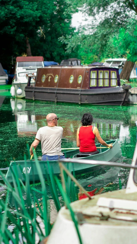 a couple of people that are in a boat on some water