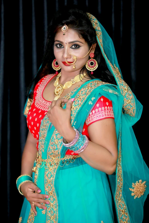 a woman with makeup on her face and jewelry