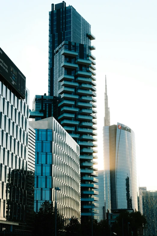 a group of very tall buildings on a street