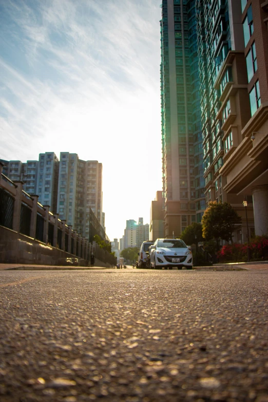 two vehicles are parked along a street outside