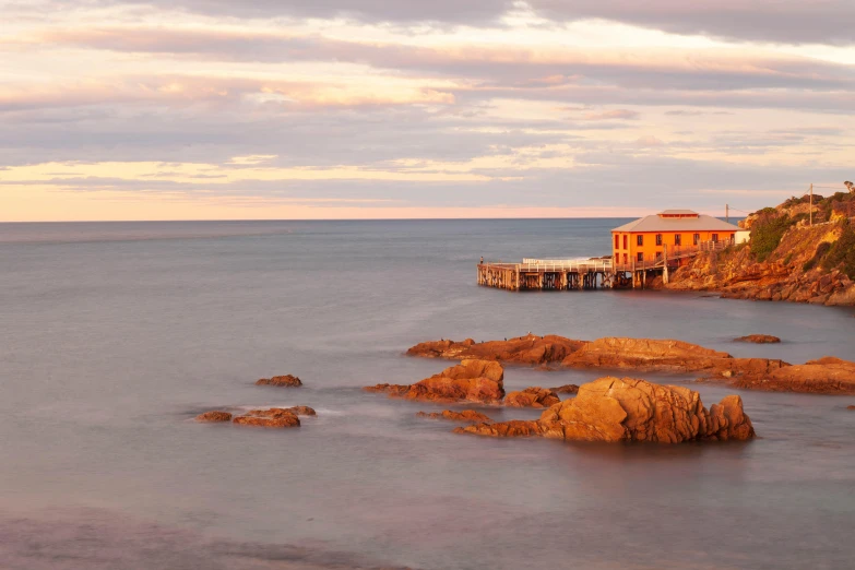 an old pier in the middle of the water