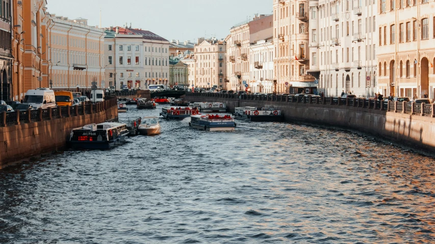 a canal is crowded with many small boats