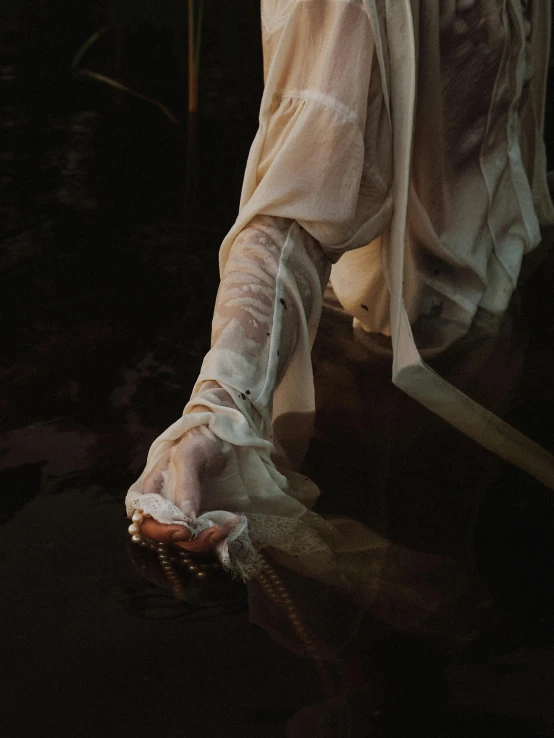 an old woman wearing white stockings and holding her hand