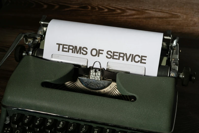 an old fashioned typewriter reading the term of service