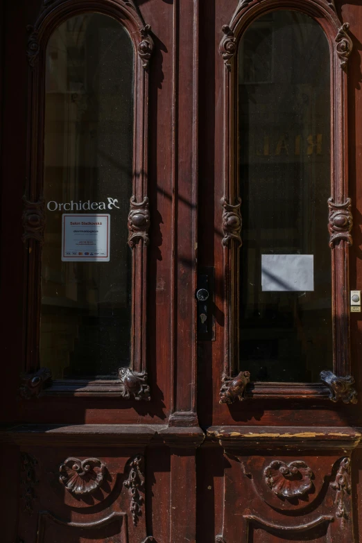 a large wooden door with ornate carved frame