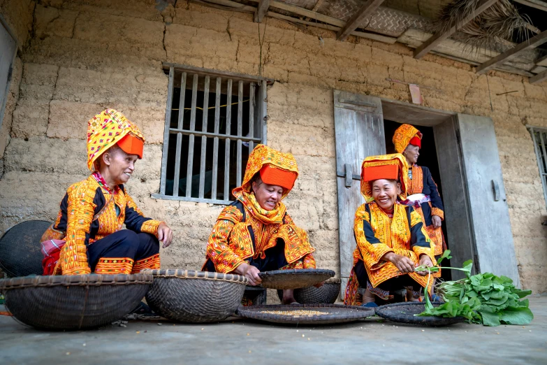 three young indian men are dressed with yellow colored clothes