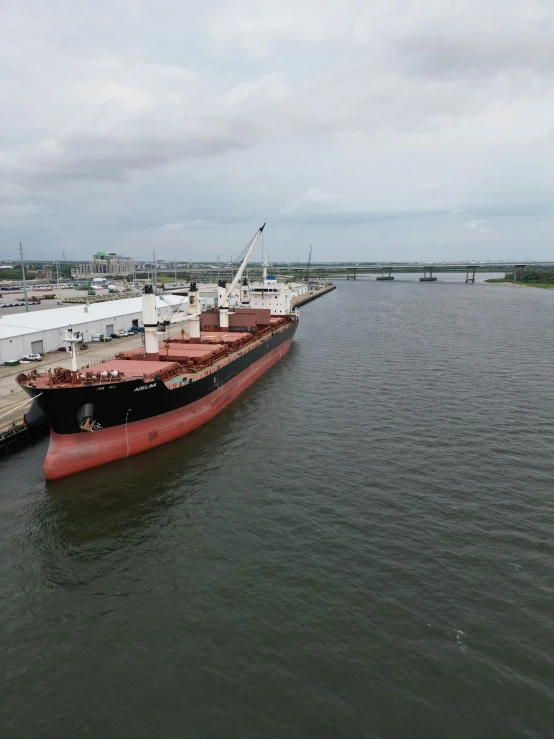 the large cargo ship is waiting to be unloaded