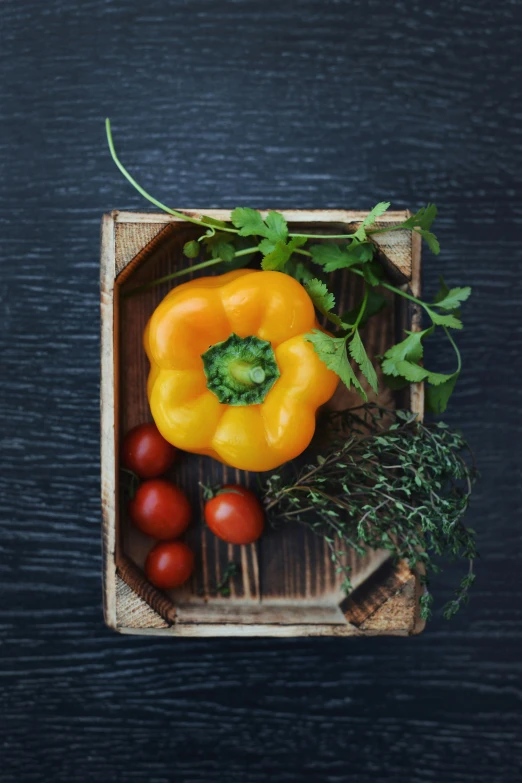 a bunch of vegetables on top of a wooden board