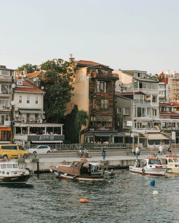 some cars water boats and buildings and trees