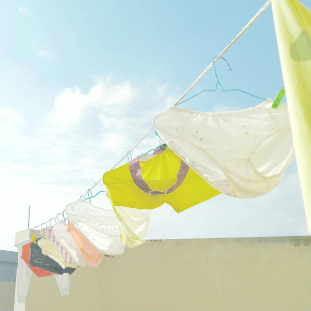 clothes on line next to the sand in a city