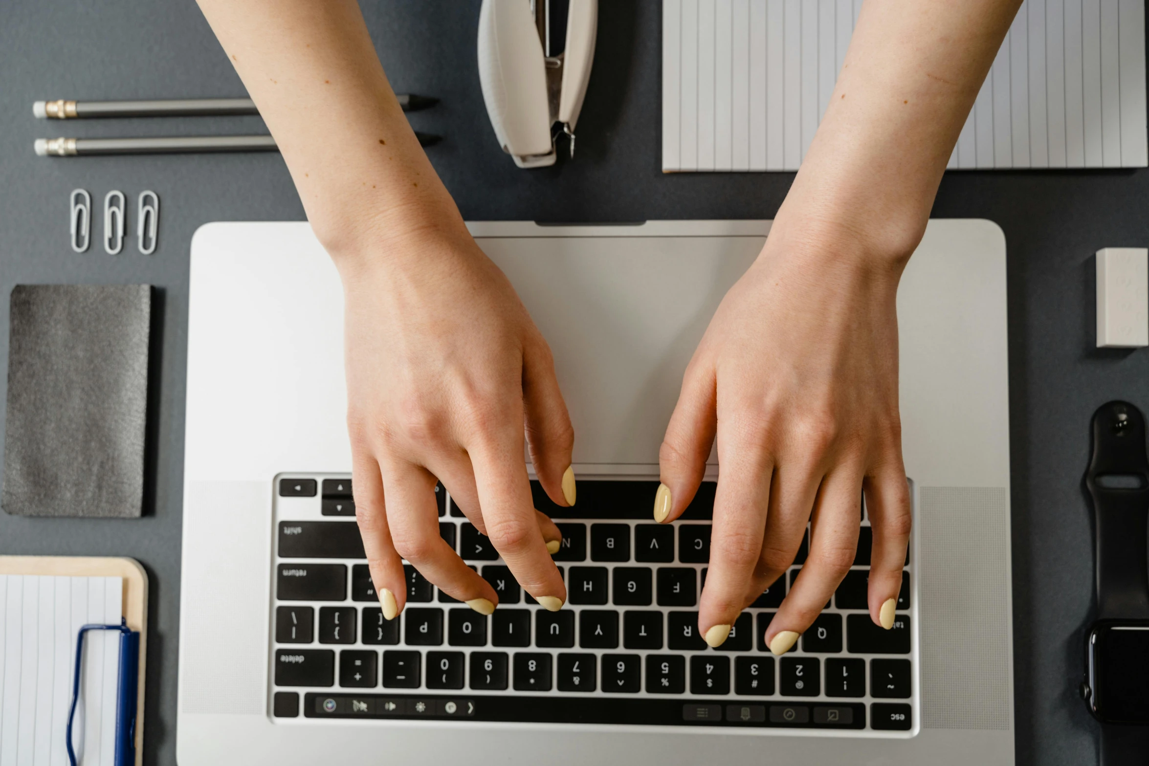 the person is typing on a computer keyboard