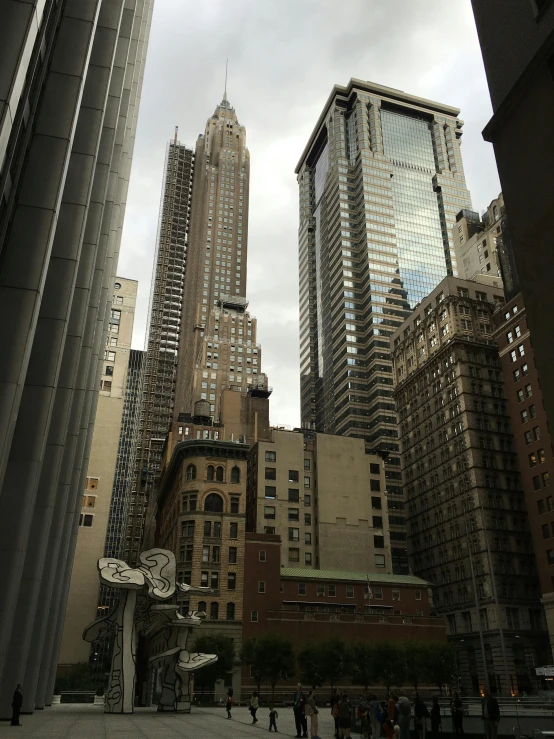 tall buildings surround a city square in new york