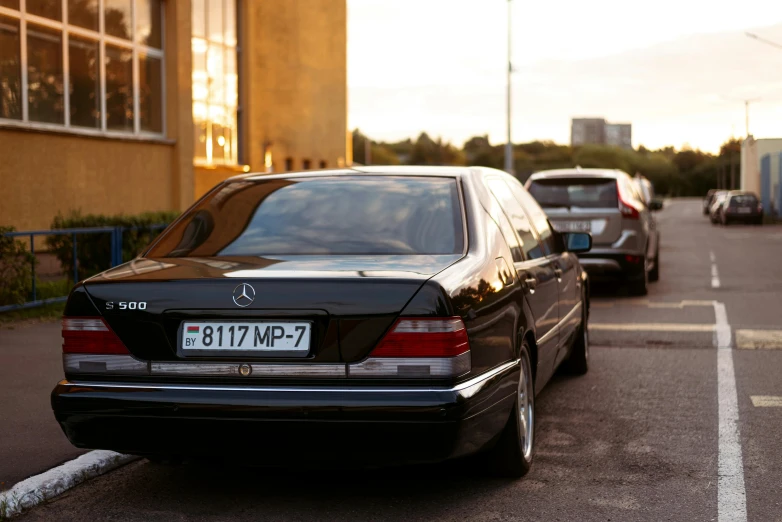 a lot of cars parked outside some buildings