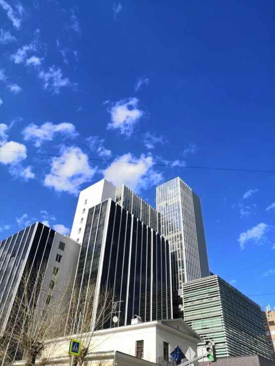 some very tall building on the side of a road