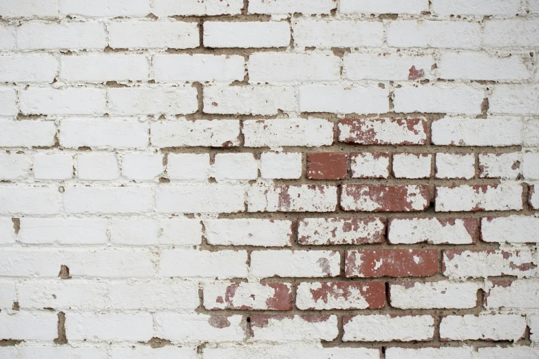 a brick wall with s painted on it