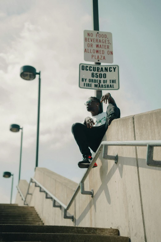 a person doing skateboarding tricks on a stair rail