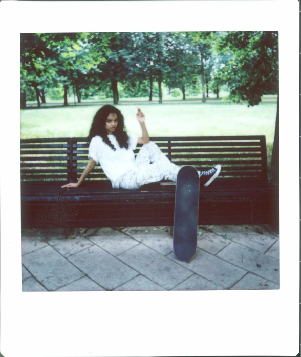 girl with long hair sitting on a bench