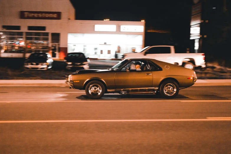 a brown car parked on the side of the street