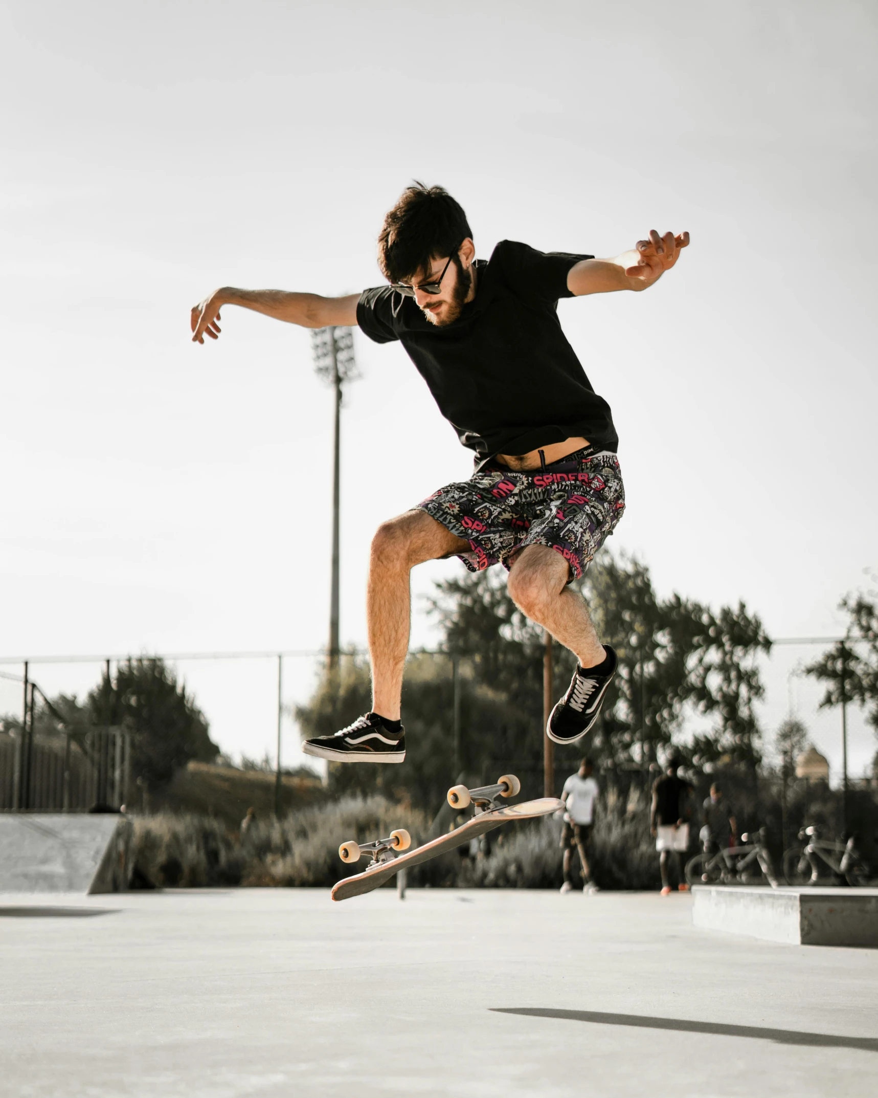 a guy performing a trick on a skateboard