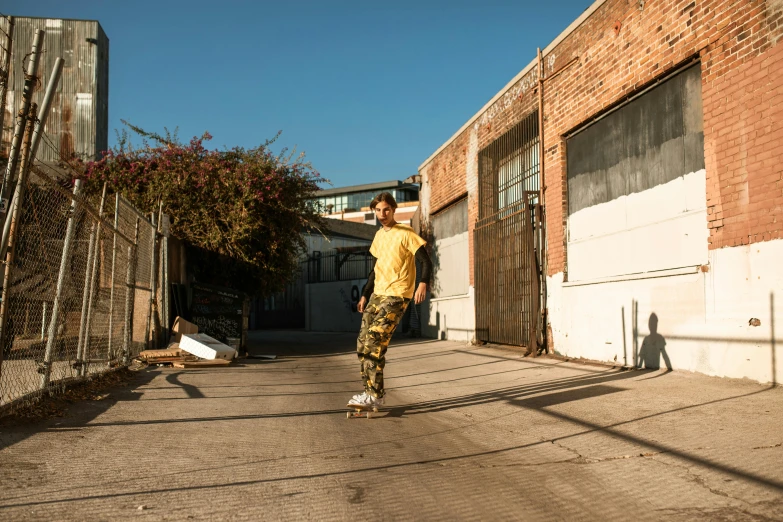 a man with a helmet on skates down a sidewalk